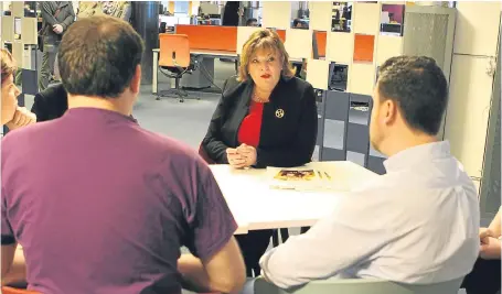  ?? Picture: Gareth Jennings. ?? Fiona Hyslop chats to staff at Dundee gaming company Outplay.
