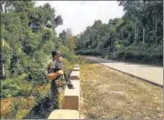  ?? HT PHOTO ?? An Assam police officer at the spot of the firing.