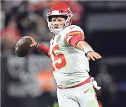  ?? GARY A. VASQUEZ/USA TODAY SPORTS ?? Chiefs quarterbac­k Patrick Mahomes throws against the Las Vegas Raiders on Sunday in Las Vegas.