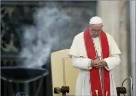  ?? AP PHOTO/ALESSANDRA TARANTINO, FILE ?? In this July 31 photo, Pope Francis prays during an audience in St. Peter’s square at the Vatican.