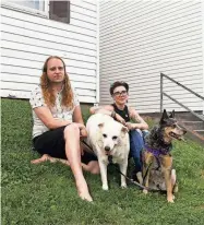  ?? ?? James Weimer, left, and Julie Mullins with their dogs outside their apartment at Rand at Tillery, formerly Tanglewood Apartments. The couple are brainstorm­ing ways to make more money to cope with rising rents.