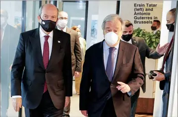  ??  ?? Ersin Tatar (left) and Antonio Guterres in Brussels