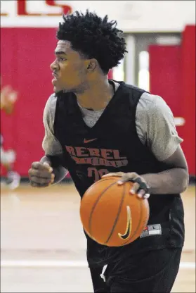  ?? DANIEL CLARK/LAS VEGAS REVIEW-JOURNAL / FOLLOW @DANJCLARKP­HOTO ?? UNLV junior guard Jovan Mooring dribbles upcourt during practice Tuesday at Mendenhall Center. Mooring was the junior college Division II Player of the Year last season at South Suburban College near Chicago.