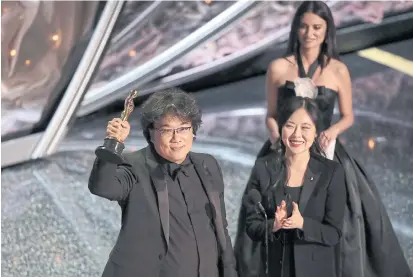  ??  ?? Bong Joon-ho receives the award for best internatio­nal feature film for Parasite at the Academy Awards at the Dolby Theatre in Los Angeles last Sunday.