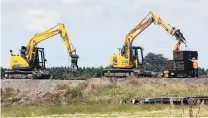  ?? PHOTO: LUISA GIRAO ?? KiwiRail's contractor­s work to repair the damaged track at Wright’s Bush after a train derailed.