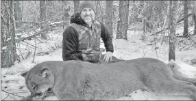  ??  ?? Ecklund holds a cougar in a photo from his Facebook page. — Facebook photo