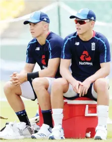  ?? — AFP photo ?? England cricketers and brothers Tom Curran (left) and Sam take rest during a practice session at the Rangiri Dambulla Internatio­nal Cricket Stadium in Dambulla, in this October 8, 2018 file photo.