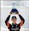  ??  ?? Pato O’Ward celebrates after winning the second race of the IndyCar Detroit Grand Prix auto racing doublehead­er on Belle Isle in Detroit, on June 13. (AP)