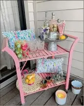  ?? Provided ?? A bar cart curated by Elizabeth Hunter at her Saratoga Springs apartment.