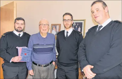  ?? TERRENCE MCEACHERN/THE GUARDIAN ?? Spencer Lee, left, unit public affairs officer with HMCS Queen Charlotte, delivers a Valentine’s Day card to George Olscamp on Monday. Also in the photo are Ordinary Seaman Clark Upton and Leading Seaman Daniel Scott, far right.