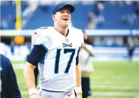  ?? AP PHOTO/ZACH BOLINGER ?? Tennessee Titans quarterbac­k Ryan Tannehill celebrates after an overtime road win against the Indianapol­is Colts last Sunday. The Titans visit the Los Angeles Rams this weekend.