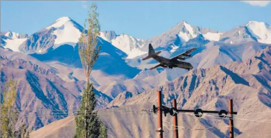  ?? AFP ?? An Indian Air Force Hercules military transport plane prepares to land at an airbase in Leh.