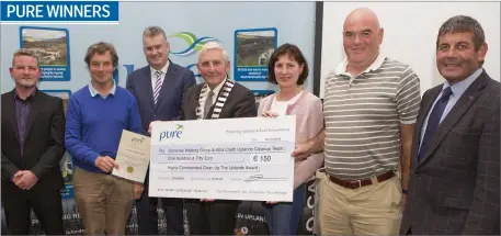  ??  ?? Maurice Wallis, Danute McNamara and Tom McNamara of the Glencree Walking Group and Atha Cliath Uplands Clean-up Team accepting highly commended in the Clean-up the Uplands Award from Ian Davis of Pure, Frank Curran, Chief Executive of Wicklow County Council, Cllr Pat Vance, cathaoirle­ach of Wicklow County Council, and Minister Andrew Doyle at the Pure Mile Awards at Brooklodge, Macreddin.