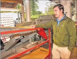  ?? CHRIS HUNT / SPECIAL ?? Lee Dickey, vice president of Dickey Farms, explains the peach-sorting process at his family business in Musella. His company is prevented from exporting peaches to Mexico and he wants NAFTA to be re-examined.