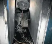  ??  ?? GUTTED: A charred toilet in the Ezibeleni community hall, which was set alight during protests on Monday