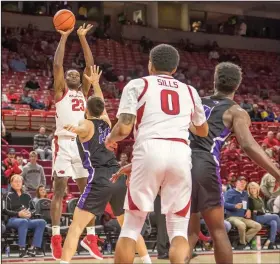  ?? Crant Osborne/Special to the News-Times ?? Taking aim: Arkansas' Ibrahim Ali takes a shot during the Razorbacks' exhibition game against Southwest Baptist last week at Fayettevil­le. Tonight, the Razorbacks open the regular season by taking on Texas.