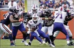  ?? DAVID BANKS ?? Chicago Bears’ James Vaughters, left, and Bilal Nichols (98) pressure Buffalo Bills quarterbac­k Mitchell Trubisky during the first half of an NFL preseason football game Saturday, Aug. 21, 2021, in Chicago.