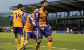  ?? Photograph: Tim Goode/PA ?? Stephen McLaughlin celebrates scoring the only goal on the night for Mansfield to secure victory over Northampto­n.