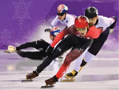  ?? MLADEN ANTONOV/AFP/GETTY IMAGES ?? Canadian Samuel Girard managed to get to the front of the pack, with American John-Henry Krueger, right, and avoid the crash involving South Korea’s Seo Yira and Lim Hyojun in the men’s 1,000-metre short track final.