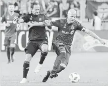  ?? CHRIS YOUNG THE CANADIAN PRESS ?? Michael Bradley, right, battles with Los Angeles FC’s Marco Urena during first-half MLS action in Toronto FC’s 4-2 loss on Saturday.