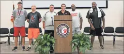  ??  ?? The Cedartown Football Coaching Staff gathered on stage during Dinner with the Dawgs, a fundraisin­g event for the Football Booster program.