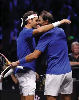  ?? ?? Roger Federer joined up with Rafa Nadal for his final game in London