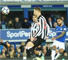 ?? — AFP photo ?? Theo Walcott (right) shoots but fails to score during the English Premier League match between Everton and Newcastle United at Goodison Park in Liverpool, north west England.
