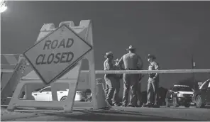  ?? COURTNEY SACCO/USA TODAY NETWORK ?? The road near the First Baptist Church in Sutherland Springs, Texas is blocked while the investigat­ion continues.