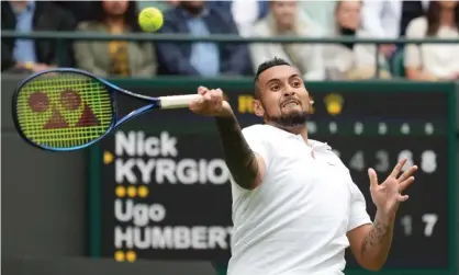  ??  ?? Nick Kyrgios plays a return to Ugo Humbert as the Australian completed a five-set win in the first round at Wimbledon. Photograph: Alberto Pezzali/AP