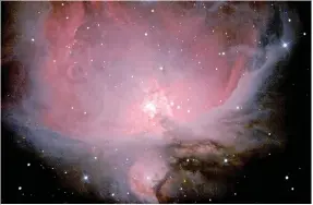  ?? David Cater/Star-Gazing ?? This image of new star formation in Orion The Hunter — designated M42 — was taken with John Brown University’s 16-inch telescope housed at New Life Ranch in Colcord, Okla. The colors are generated by a type of fluorescen­ce caused by the ultraviole­t...