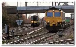  ?? CHRIS DENHAM/NETWORK RAIL. ?? On December 15, Freightlin­er 66518 waits for South Western Railway 444023 to pass with a service for Weymouth.