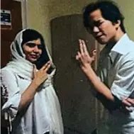  ??  ?? Manifesto: Malala and friend Tiger