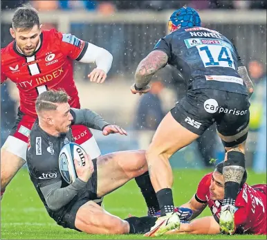  ?? ?? Scotland skipper Stuart Hogg is tackled by Saracens’ Alex Lozowski at Sandy Park