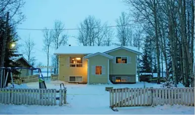  ?? JASON FRANSON/THE CANADIAN PRESS ?? Police tape surrounds a home in La Loche, Sask., where two teens were killed Friday. Two other people were killed at a school.