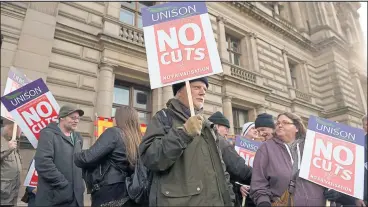  ??  ?? Unison members protesting previous council cuts outside the City Chambers in George Square