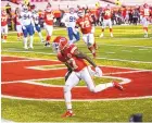  ?? JEFF ROBERSON/ASSOCIATED PRESS ?? Kansas City’s Mecole Hardman scores on a 3-yard TD reception during the AFC championsh­ip game against Buffalo on Sunday — soon after he muffed a punt.