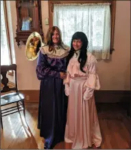  ?? JOHN BAYS/NEWS-SENTINEL ?? In Motion Theater Company actors Miranda LaBrecque, left, and Cami Ferry, right, dressed as Mary Hill and Nellie Hill respective­ly during the grand reopening of the Hill House Museum and Bed and Breakfast on Thursday evening.