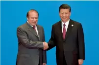  ?? AFP ?? Prime Minister Nawaz Sharif shakes hands with Chinese President Xi Jinping during a welcoming ceremony for the Belt and Road Forum in Yanqi Lake, north of Beijing. —