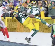  ?? JOURNAL SENTINEL FILES ?? Packers free safety Ha Ha Clinton-Dix (middle) and cornerback Damarious Randall break up a pass to Giants wide receiver Tavarres King during the playoffs in January.