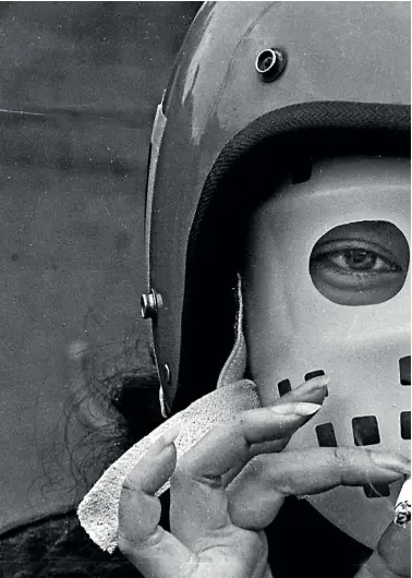  ?? JOHN SELKIRK RICKY WILSON/STUFF ?? A well-prepared protester has a quiet smoke as she waits at Fowlds Park for the march to Eden Park before the playing of the third All Blacks test against the Springboks on September 12, 1981.