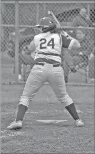  ?? Photos by GREG DAVIS and KATRINA CHAVERS/SPECIAL to The Saline Courier ?? LEFT: Bauxite senior Destiny Mcclain slides in safely in a game this past season. ABOVE: Senior Taylor Sledd takes an at-bat in a game this past season. Both Sledd and Mcclaine earned All-state honors.