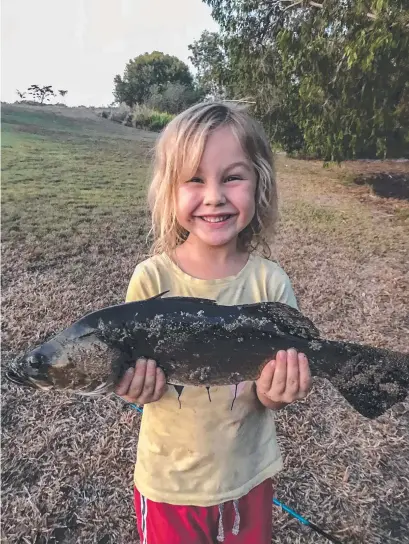  ??  ?? RELEASED: The first barramundi for five-year-old Lucy Harvey-sutton, caught while fishing near Forrest Beach.