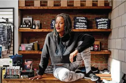  ?? Nick Hagen / New York Times ?? Consumers’ pandemic reliance on online ordering benefited the giants. For many independen­t retailers, like Amina Daniels, owner of Live Cycle Delight in Detroit, it helped keep the doors open.