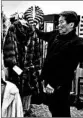  ?? ERIC RISBERG/AP ?? Benjamin Lin holds up a fur coat at a San Francisco store. The sales ban on furs is set to begin Jan. 1.