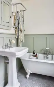  ??  ?? BATHROOM
Antique style rules, with an elegant clawfoot bath from The Cast Iron Bath Company and hexagonal floor tiles from Fired Earth