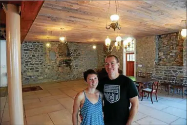  ?? TANIA BARRICKLO — DAILY FREEMAN ?? Amanda and Anthony Stromoski are shown Wednesday inside the building at 82 John St. in Uptown Kingston, where they plan to open Rough Draft Bar & Books.