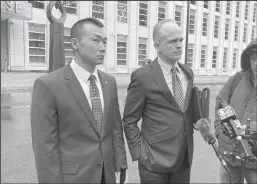  ?? JOHN ANNESE/NEW YORK DAILY NEWS ?? Baimadajie Angwang, left, with his lawyer, John Carman, outside Brooklyn Federal Court on Thursday, after charges against him were formally dismissed.