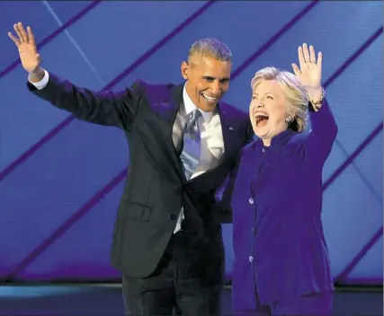  ?? Matt Freed/Post-Gazette photos ?? Democratic presidenti­al nominee Hillary Clinton joins President Barack Obama on stage Wednesday after he spoke at the party’s convention at Wells Fargo Center in Philadelph­ia.