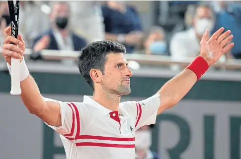  ??  ?? SEMI WINNER: Novak Djokovic celebrates his stunning success over 13-time French Open champion Rafael Nadal.