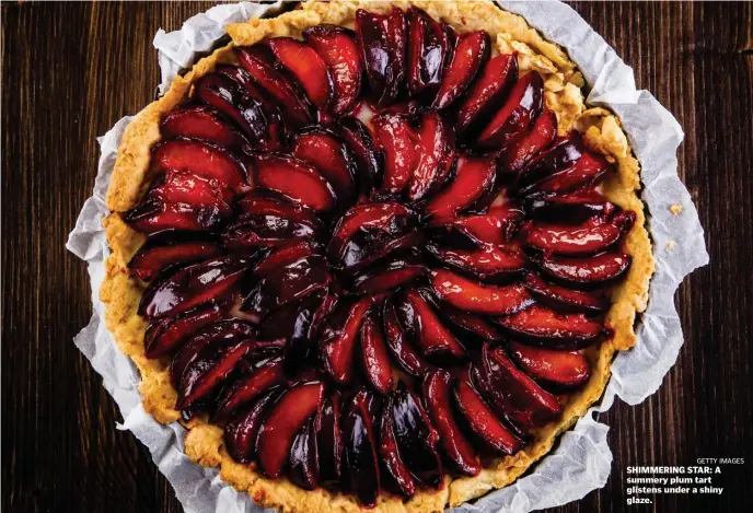  ?? gETTy ImAgES ?? SHIMMERING STAR: A summery plum tart glistens under a shiny glaze.